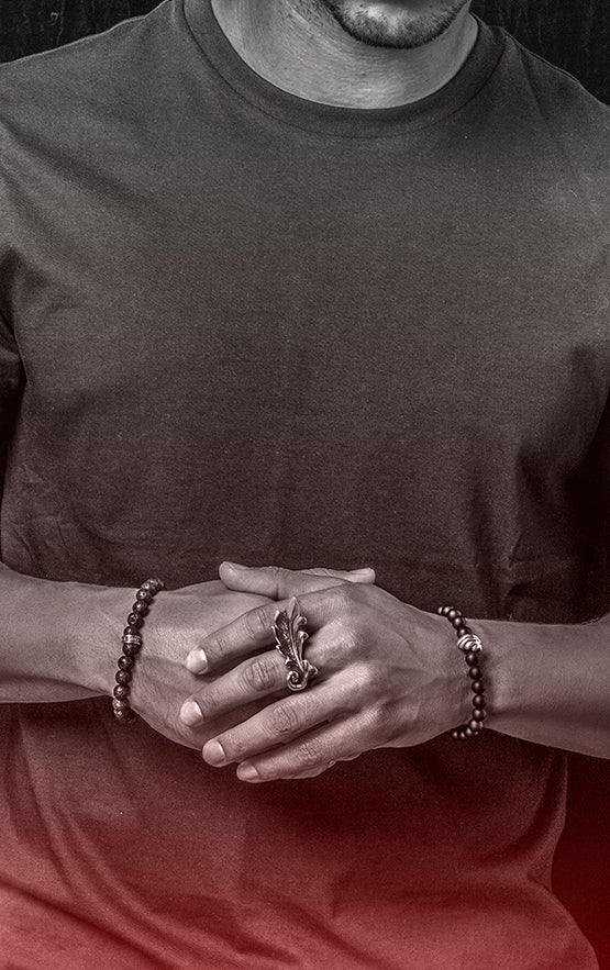 man wearing beaded king baby bracelets