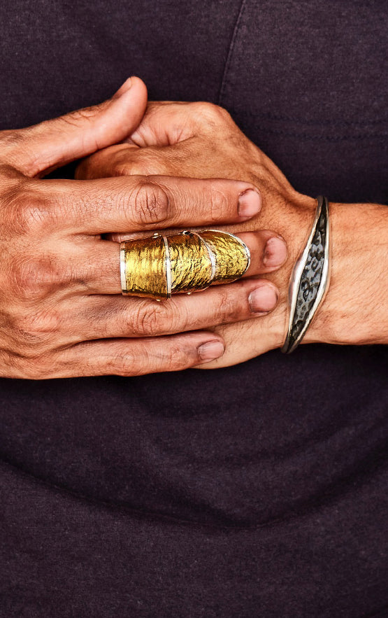 man wearing king baby jewelry